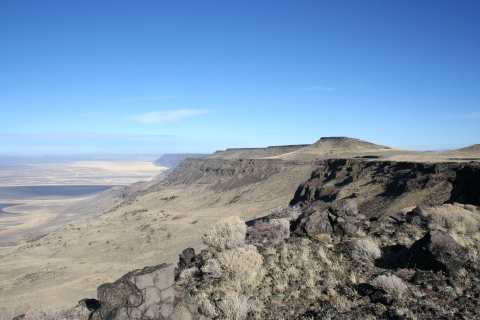 Mountain ridges, sagebrush and distant desert all viewable on a clear day.