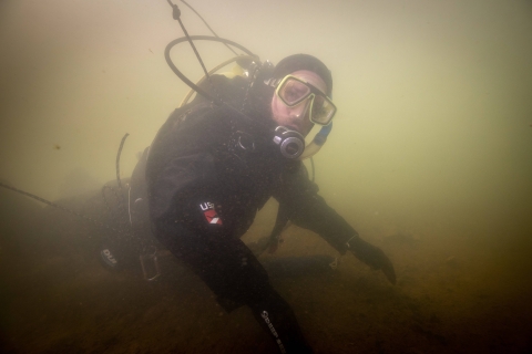 USFWS River diver surveys underwater habitat for freshwater mussels. Photo Credit: Ryan Hagerty/USFWS