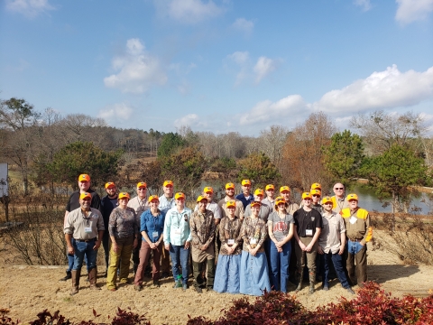 CLfT participants stand in 2 rows for group photo. 