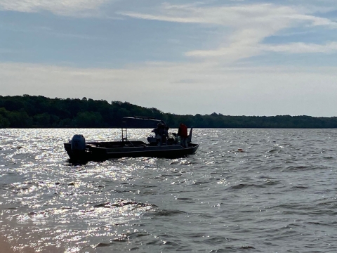 Silhouette of a boat on a lake