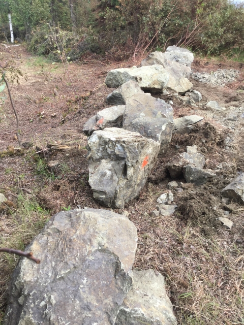 Boulders placed at the fireline entrance along the Dalton Highway where the fireline begins.