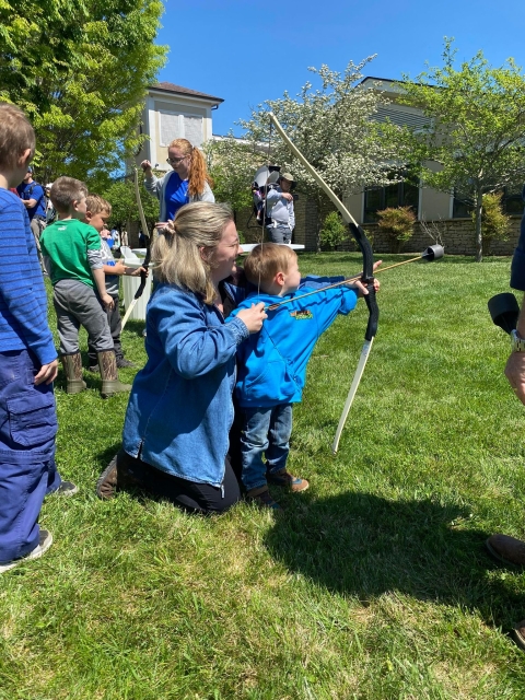 Child shooting soft tip archery