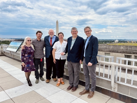 Team from the National Oceanic and Atmospheric Administration's Fisheries-Oikonos Seabird Bycatch Project pose with their award in front of the D.C. Washington Monument