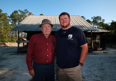 Left, Joe Lester Chesser and his grandson Andrew stand in front of the old Homestead site that is now part of the Okefenokee National Wildlife Refuge. Joe, 89, grew up there and left when the refuge took over in 1971. Today Andrew works for the American Conservation Experience taking care of 120 canoe trails in the refuge. 