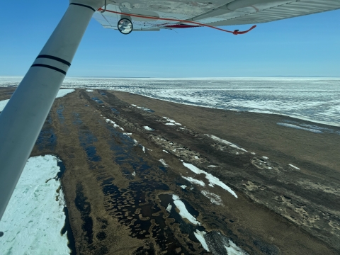 aerial view of a landscape with snow