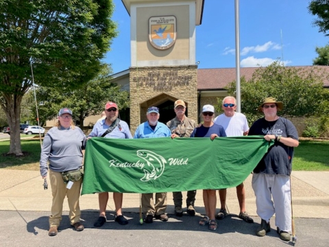 Group photo holding Kentucky Wild banner