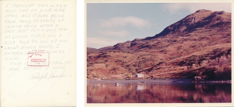 A diptych of two images. The first is a note with handwritten text. I thought this was a good shot of your home chris and it sure brings back fond memories of coming home after a days hunt for a good meal at Clara's table and a nice talk to all of you about other unts. I enjoyed Lenord's film so much. How is Lenord feeling now, better I hope. Ralph Hawkin. The second image is a photo of small buildings on the shore of a bay and at the foot of a mountain.