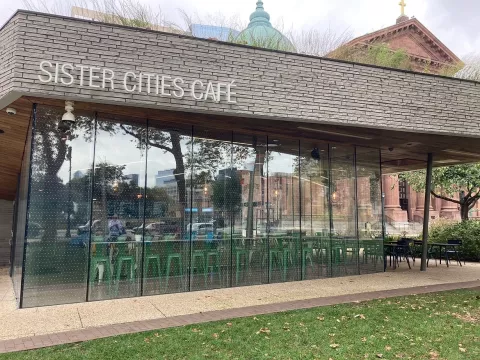 A cafe's glass is covered in small dots to make sure it is visible to birds