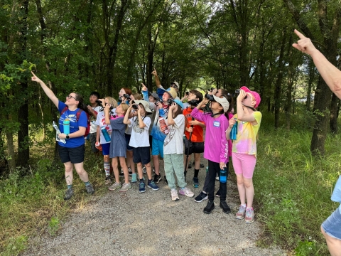 School Group Looks at an Eagle using binoculars on Harris Creek Trail