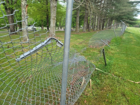 Hatchery fence destroyed by high winds and downed trees