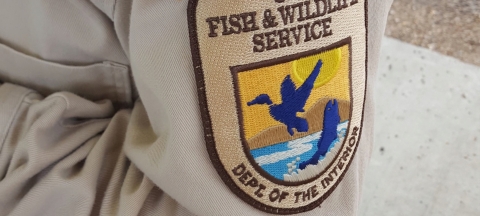 A closeup of a United States Fish and Wildlife Service Patch on a uniform.