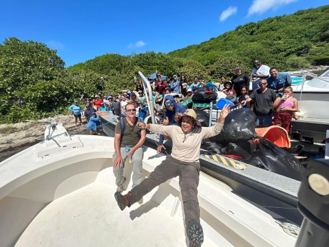 Culebra NWR staff and community members posing with the 1,355.2 pounds of trash that were collected during the International Coastal Cleanup Day.