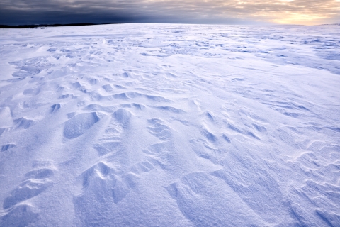 Snowy landscape with wind patterns