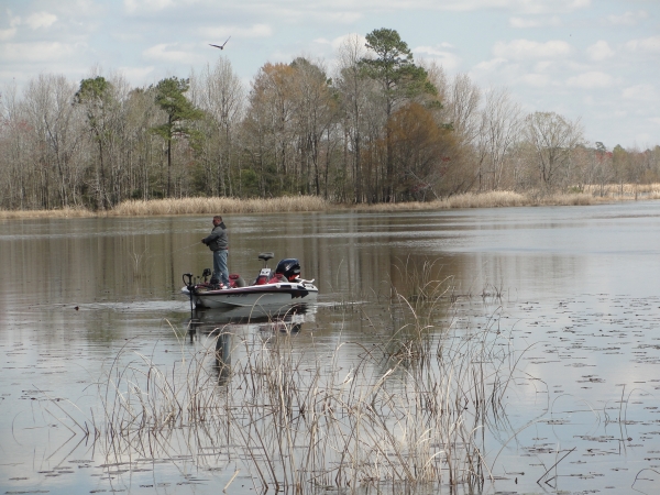 Man fishes in the lake at Santee NWR