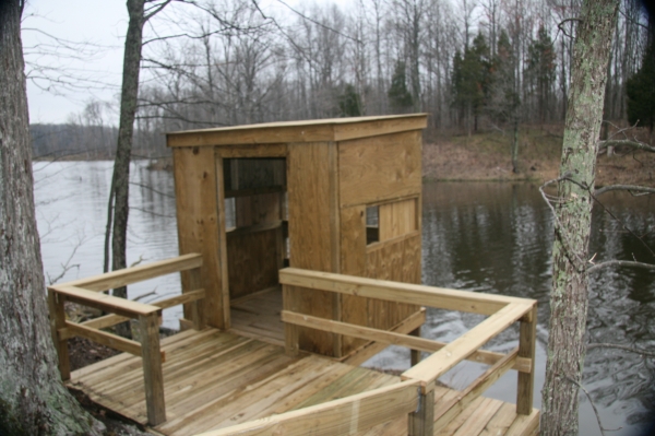 wooden photo blind on lake