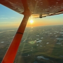 View from an airplane of the sunrise over the landscape