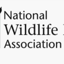 A logo with an image of a bird soaring over a marsh and the words National Wildlife Refuge Association next to it