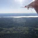 view of an airplane wing over the landscape