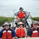 four people in an airboat