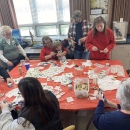 People crafting around a table