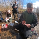 A man attached a PIT tag to a freshwater mussel