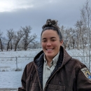 woman in USFWS uniform smiling