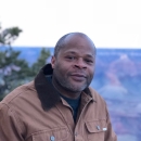 Man in brown jacket