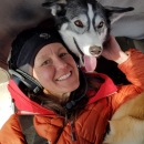 Woman in airplane with dog