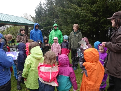 a group of kids in the rain