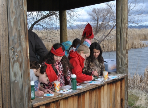 Children painting in a viewing blind at Discovery Marsh at Tule Lake NWR