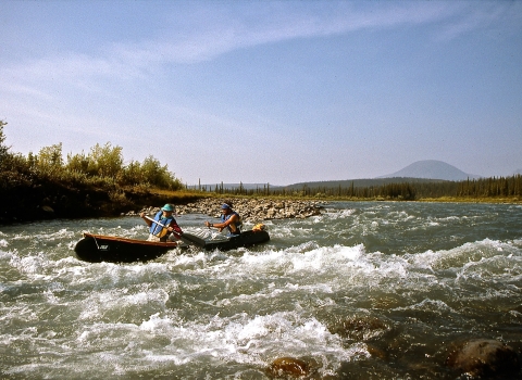 two people in boat paddling