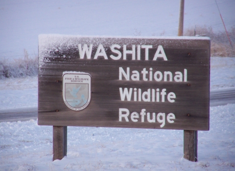 Snow covered entrance sign at Washita National Wildlife Refuge