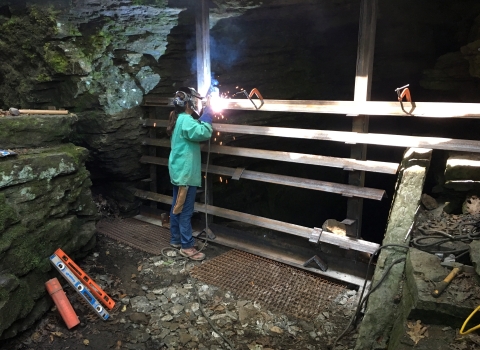 Welding cave gate at Devil's Den State Park