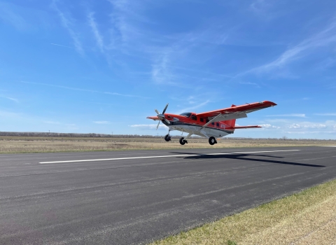 airplane coming in to land on a runway