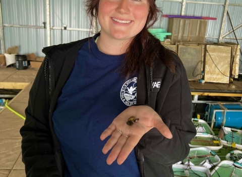 woman holding mussels