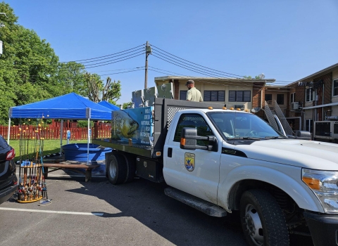 USFWS fish distribution truck unloading fish for into tank