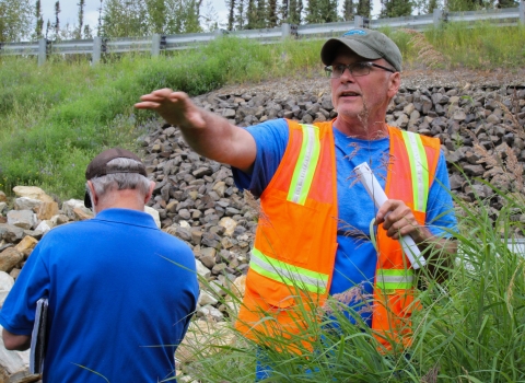 Mitch Osborne leads a group around restored sections of Cripple Creek, July 2023