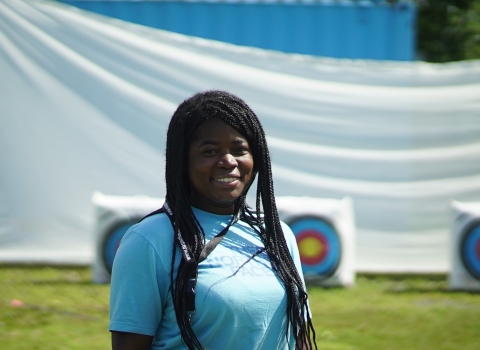 woman standing by archery targets