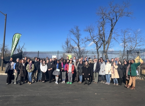 group of people outdoors posing for a photo. A small sign that reads Masonville Cove can be seen