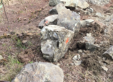 Boulders placed at the fireline entrance along the Dalton Highway where the fireline begins.