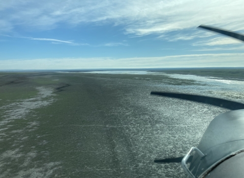 aerial view of airplane over a lake