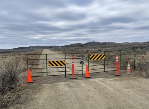 A closed gate barricades the route to the Duvall Bridge on Charles M. Russell National Wildlife Refuge Complex. Photo Credit: Mike Assenmacher / USFWS